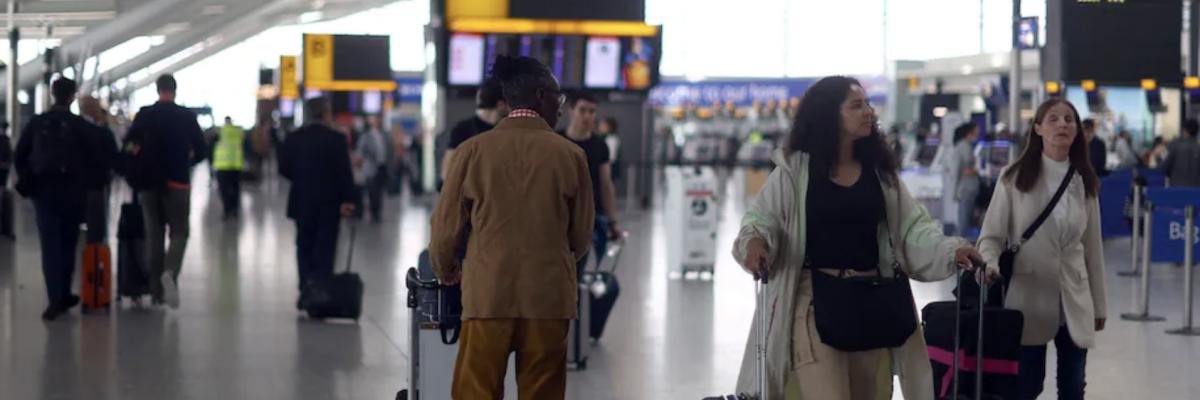 Passengers walk with their luggage through Heathrow airport in London on June 1. (Reuters/Hannah McKay)