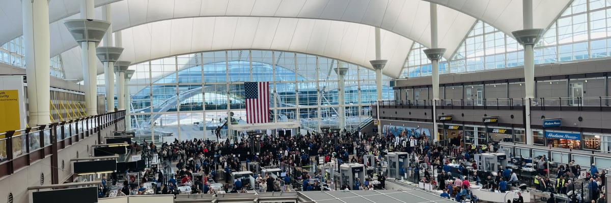 Crowded security line at Denver International Airport. Photo by Jared King