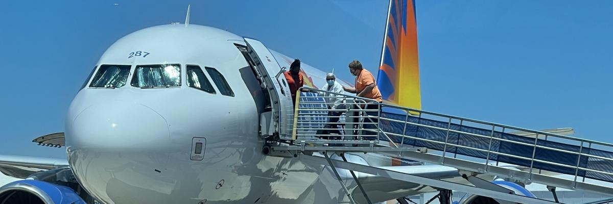 Passenger boarding an aircraft.