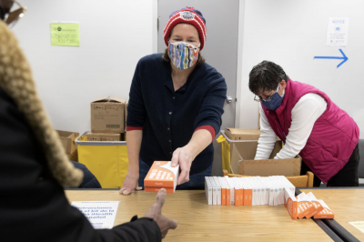 Mandatory Credit: Photo by MICHAEL REYNOLDS/EPA-EFE/Shutterstock (12761168q) Free at home antigen rapid coronavirus tests are distributed to members of the public at a library in Silver Spring, Md., on Friday. (Michael Reynolds/EPA-EFE/REX/Shutterstock)