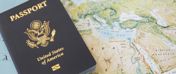 U.S. Passport and the world map.