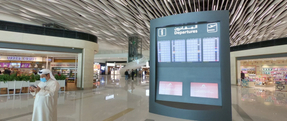 A masked passenger at new passenger terminal of Bahrain International Airport on March 29, 2021. Giuseppe Cacace/AFP via Getty Images. 