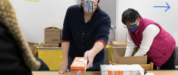 Mandatory Credit: Photo by MICHAEL REYNOLDS/EPA-EFE/Shutterstock (12761168q) Free at home antigen rapid coronavirus tests are distributed to members of the public at a library in Silver Spring, Md., on Friday. (Michael Reynolds/EPA-EFE/REX/Shutterstock)