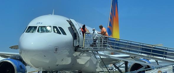 Passenger boarding an aircraft.